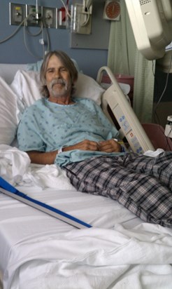 At hospital getting rod in leg to stabilize it where the cancer ate through the femur.  Grinning.