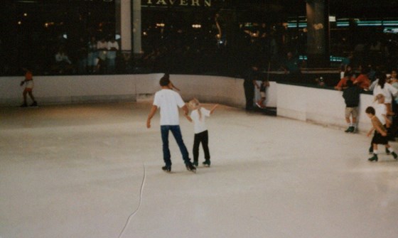 Teaching daughter Jody how to skate.