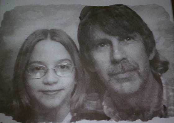 Tricia (Chuckie) and daddy Matt in photo sketch booth.  Love this.