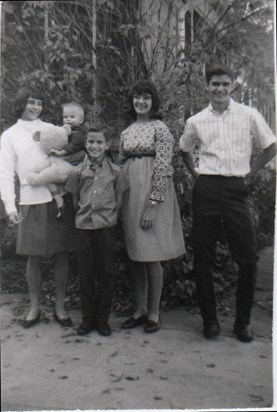 Siblings: Tammy holding baby David, Matthew, Barbara, Rick