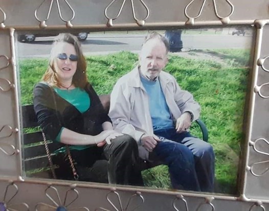 Me and My dad sat on a bench by the sea I have this picture in my living room, it's a good memory