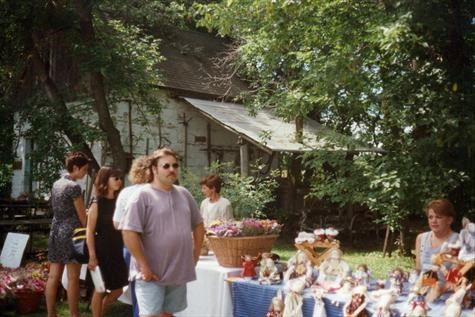Cameron  at a craft show (Cindy is sitting a the table)