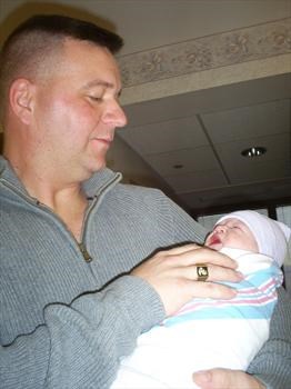 Scott holding Kathryn for the first time