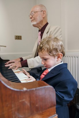 Playing piano with grandson Louis at the Wedding of Nick and Liberté, July 2017  