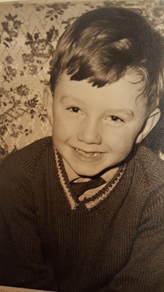 Dennis in school uniform, around 1960