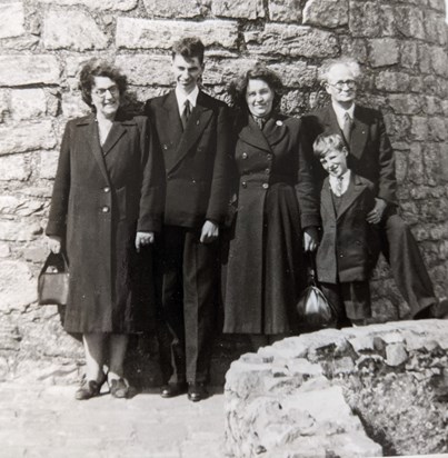 Denis as a young man with his family