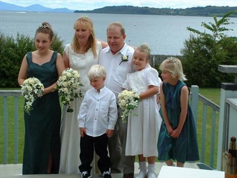 The happy couple and the beautiful bridesmaids and pageboy