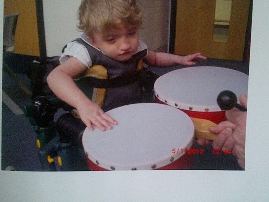 chelsea playing the drums at school