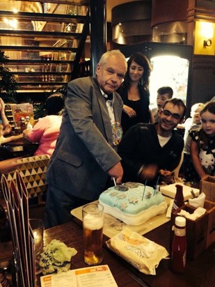 Cutting his 60th birthday cake