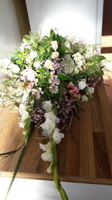Floral tribute for Peggy's coffin.