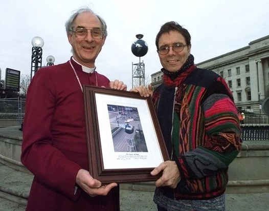 Mark with Cliff Richard, New Year's Eve 1999, presenting him with a framed picture of the Flame of Hope in Centenary Square, Birmingham.