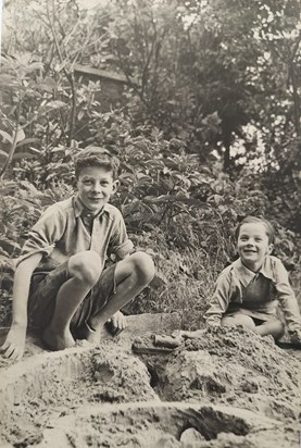 In the sandpit with sister Clare, late 1940s