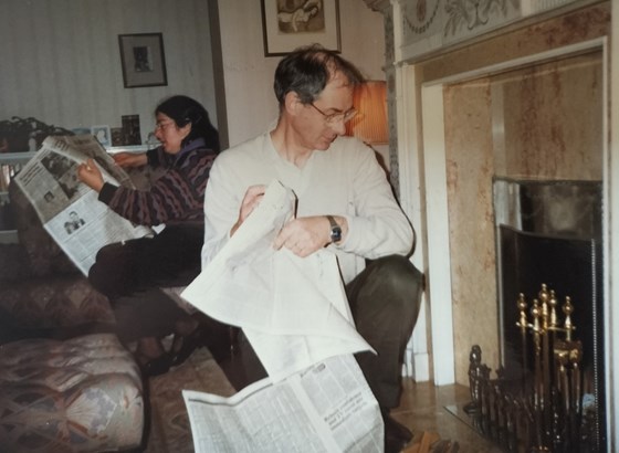 Lighting the fire. Campden Hill Square, 1980s