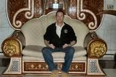 Scott Lewis sitting on the thrown at Al Faw Palace in Iraq - 2006