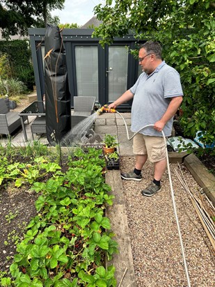 Watering instructions for the well-tended garden.