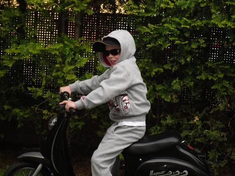 JJ on his new scooter after his 7th birthday.