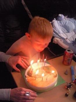 JJ blowing his candles