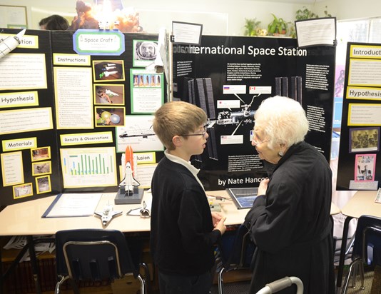 2012: Mrs. Justus talking to her Great Grandson (Nate) about his Science Fair project