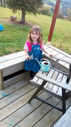 Mollie..This adorable little girl was 3 recently,she is very keen on gardening.