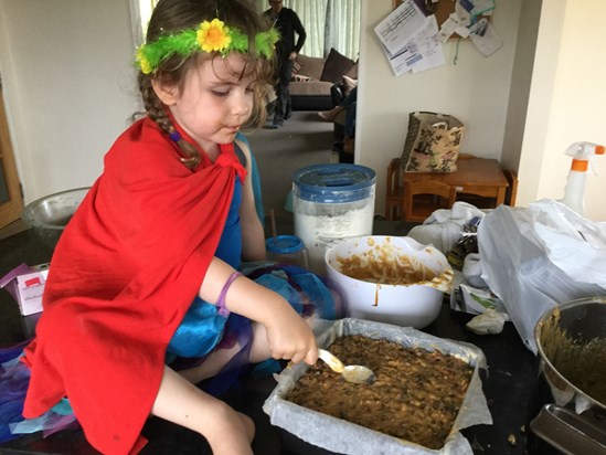 mollie following in her grandads footsteps making the Christmas cake.