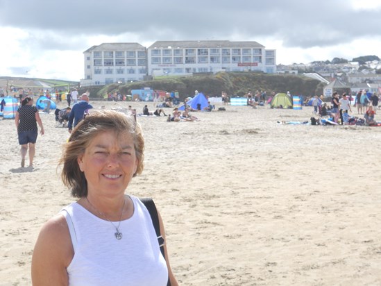 Mum on the beach with The Ponsmere Hotel in the background