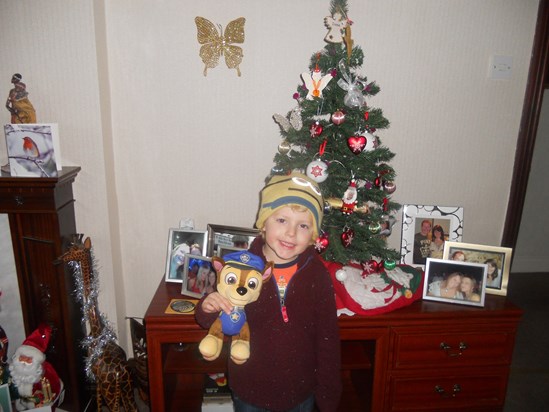 Jack stood by Mummy's Christmas Tree