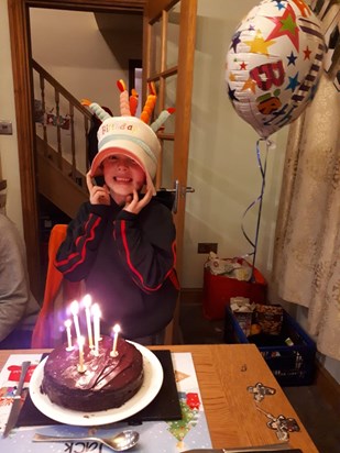 Jack wearing Mummy's birthday hat.