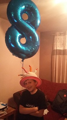 Jack wearing Mummy's birthday hat as he always does on his birthday