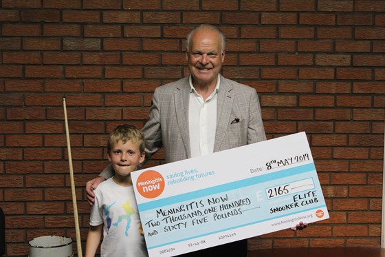 Jack presenting a cheque to Steve Dayman in memory of Mummy for Meningitis Now.