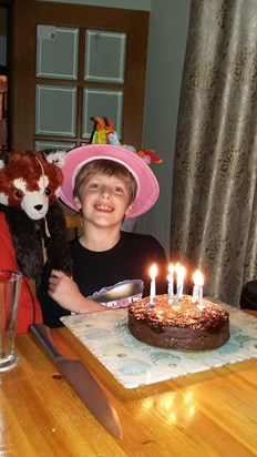 Jack wearing Mummy's hat on his birthday