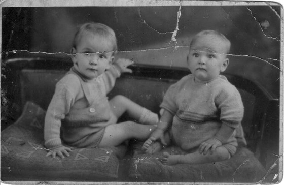 Den as a baby (on the left) with George