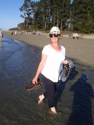 Chris enjoying a paddle in the sea.