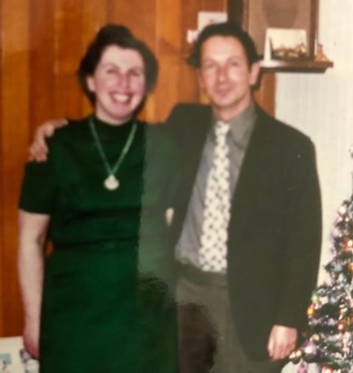 Mum & Dad In The Lounge At Home At Christmas