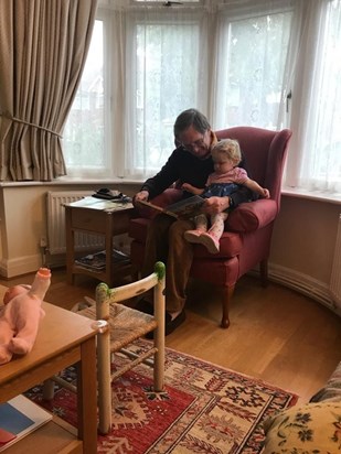 Duncan in his favourite chair reading to Florence