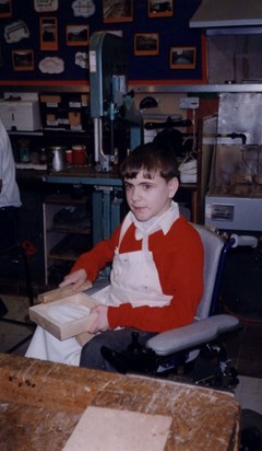 Ashley in woodwork at school aged 11