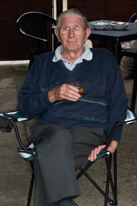 Bob Page at 79 with a glass of whisky in his hand.