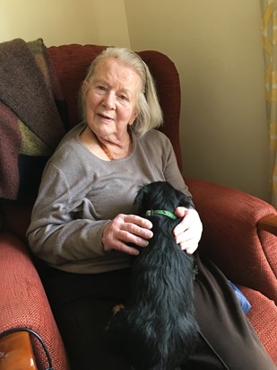 Jean with Sibyl who she loved to sit on her lap to be pushed up to the pub for lunch. 