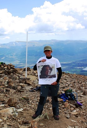 Tashia on the top of Mt. Elbert - The summit had a cross