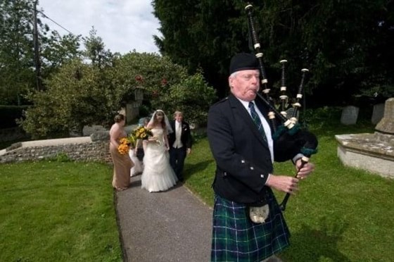 Lucinda’s wedding day.  Surprise bagpiper to walk us in.