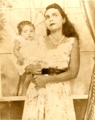 This is Tia Milagros when she was a baby and her biological mother. Our grandmother Inocencia.
