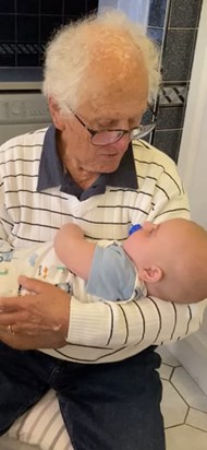 Ron holding great-grandson Archie in summer 2022 and singing to him ... we will load the video too