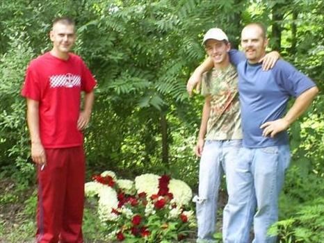 Allen, Stephen, and Jacob placing flowers back in the mountains