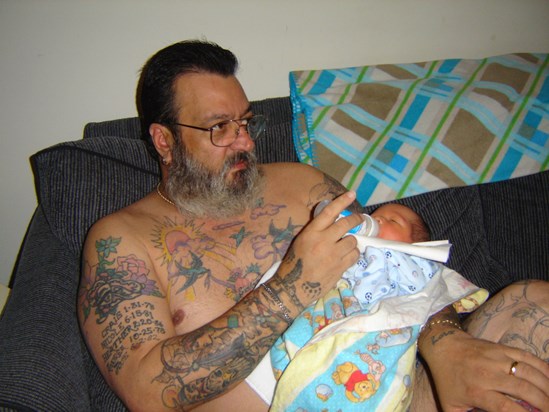 Grandpa feeding baby Dominic