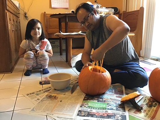 Dad and Lydia doing the pumpkin thing. 