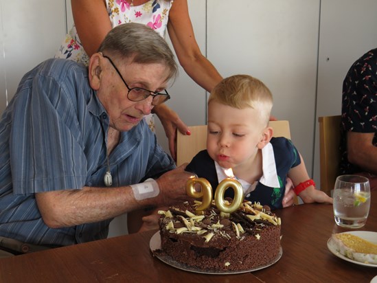 Stanley blowing out great grandad's candles