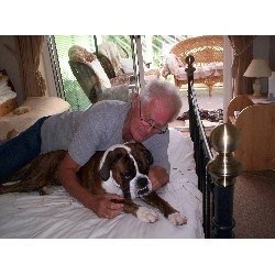 Mike with Hovis the boxer when Mike was Director of Doggie Sleepovers