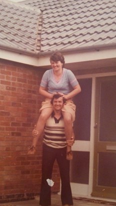 Mum on dads shoulders outside the bungalow in sileby our first family home x