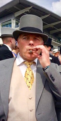 Enjoying a cigar at races 