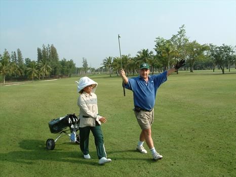 Playing golf in Thailand