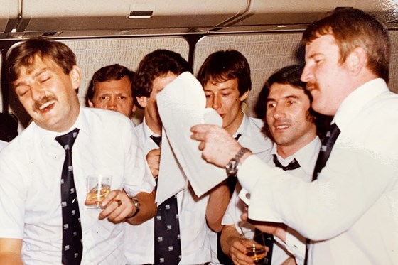 HKFC Singapore/Sydney Tour 1981. John Connors leading the singing on the flight to Sydney.